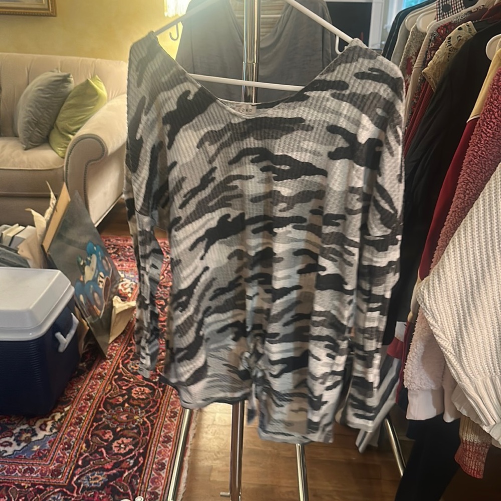 Black,grey, and white camo long sleeve top with a tie in the front